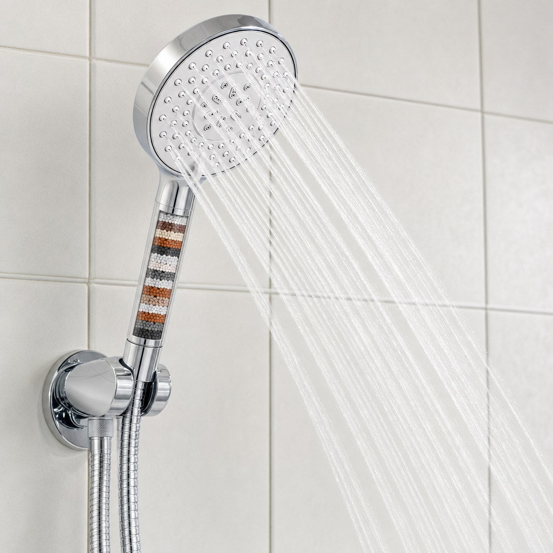 The spray against tile, showing coverage and force at full setting