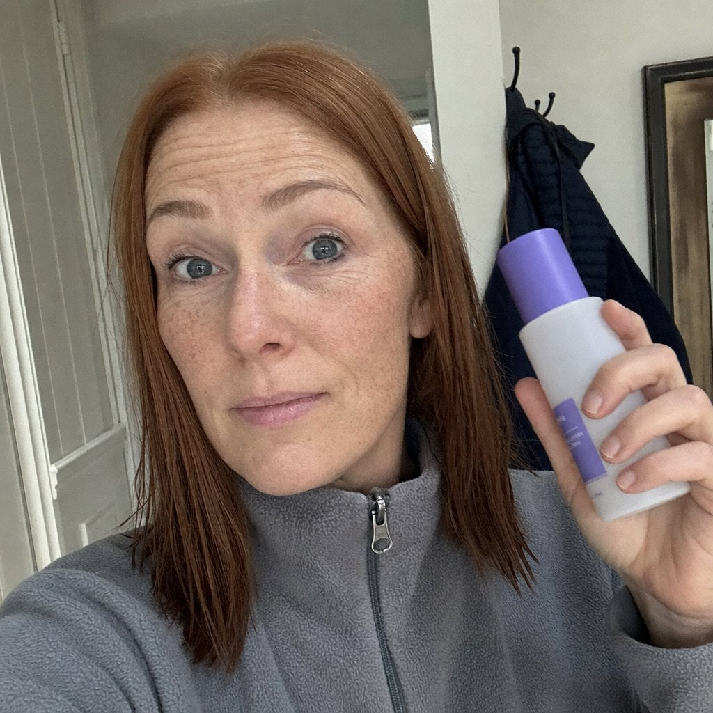 Kathleen, 49, holding the bottle