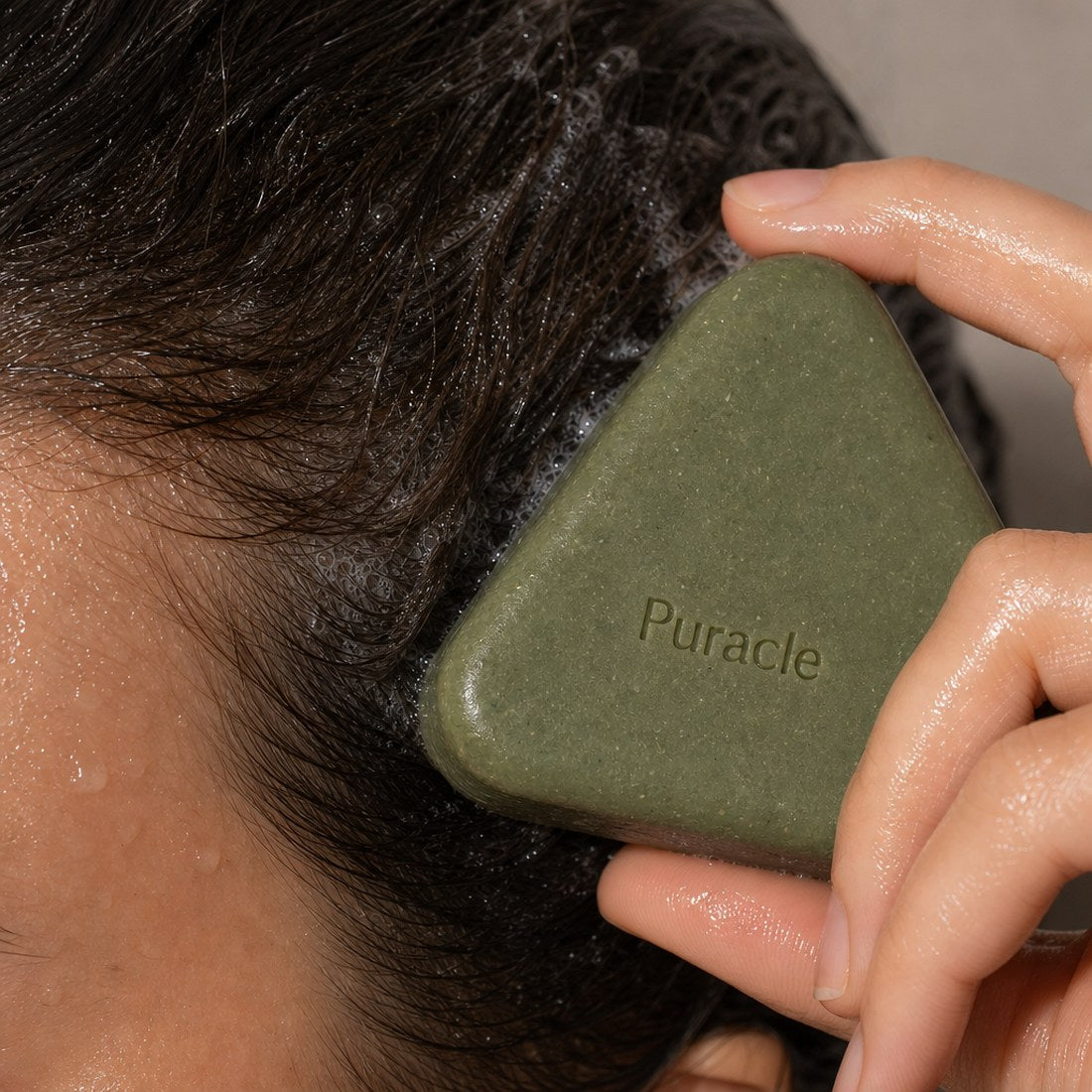 The bar rubbed directly onto a wet scalp in sections